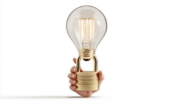 Afbeelding van een idee (gloeilamp) dat wordt beschermd en vastgehouden door een hand.